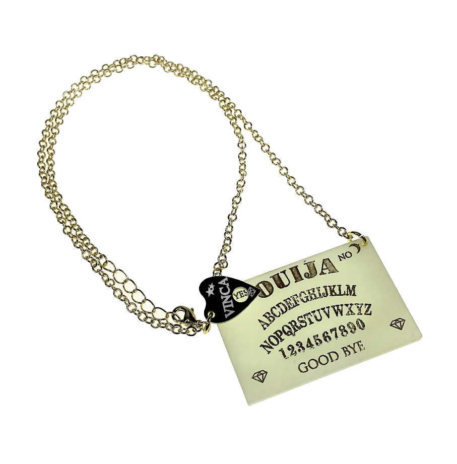 necklace featuring glow-in-the-dark laser acrylic Ouija Board pendant with gold lettering on 18" - 19" gold metal link chain with tiny black & white planchette charm by the clasp