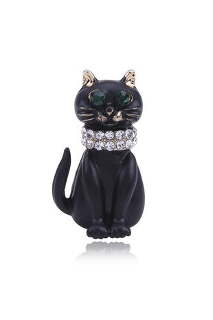 cat brooch is in matte black enamel, with clear rhinestones collar and green jewel eyes on gold metal