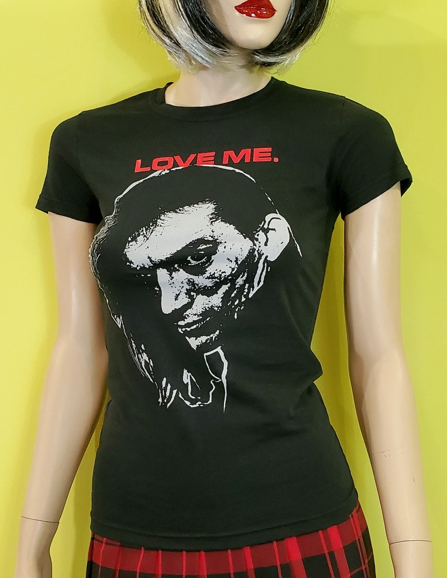 The Cramps co-founder, Bryan Gregory "LOVE ME" white image red lettering on women's 100% cotton black t-shirt, shown on mannequin