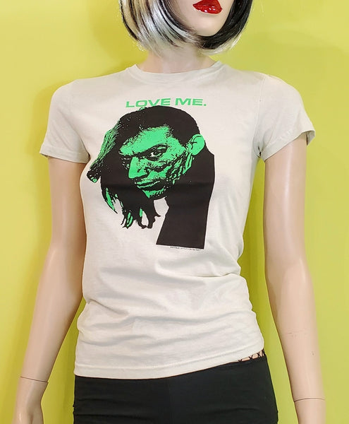 The Cramps co-founder, Bryan Gregory "LOVE ME" black neon green image lettering on women's off-white 100% cotton t-shirt, shown on mannequin