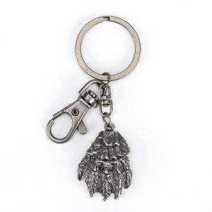 The Creature from The Black Lagoon's claw in monstrous detail dangling alongside a handy swivel hook on a sturdy metal keyring