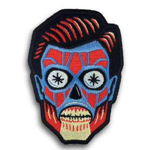 3 7/8" red, blue, brown, black stitching head of an alien from John Carpenter's 1988 sci-fi cult classic They Live embroidered iron or sew on patch