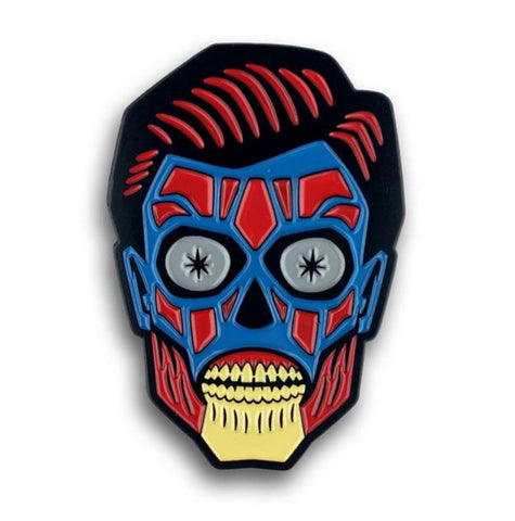 1 3/4" red, blue, cream enameled black metal head of alien from John Carpenter's 1988 sci-fi cult classic They Live clutch back pin