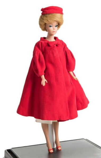 vintage barbie doll wearing red swing coat