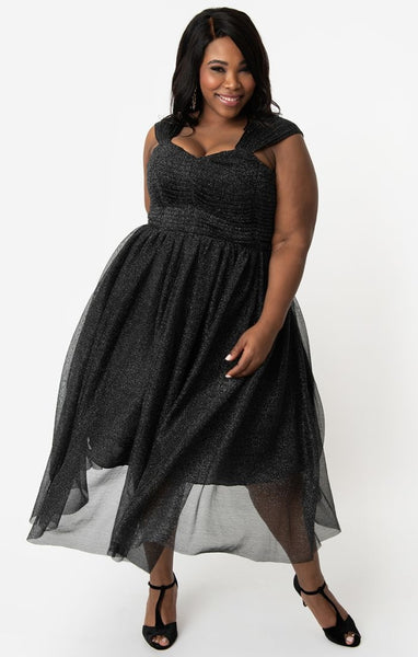 sparkly metallic black mesh retro-style dress featuring fitted boned bodice, sweetheart neckline, layers of fluffy tulle full gathered below the knee length skirt, and gathered tulle straps. shown on model