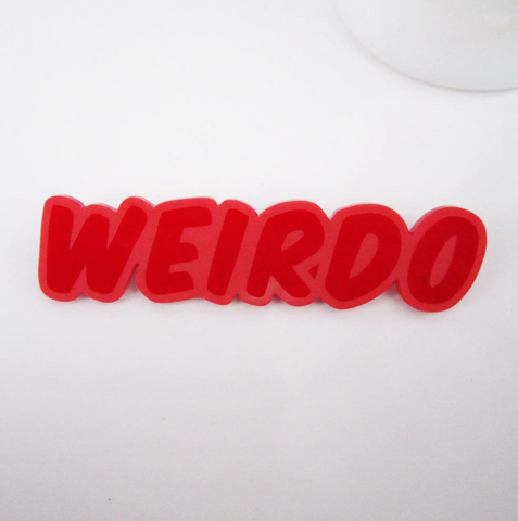 bright red 3 1/2" x 1" laser-cut and etched opaque acrylic "WEIRDO" text brooch
