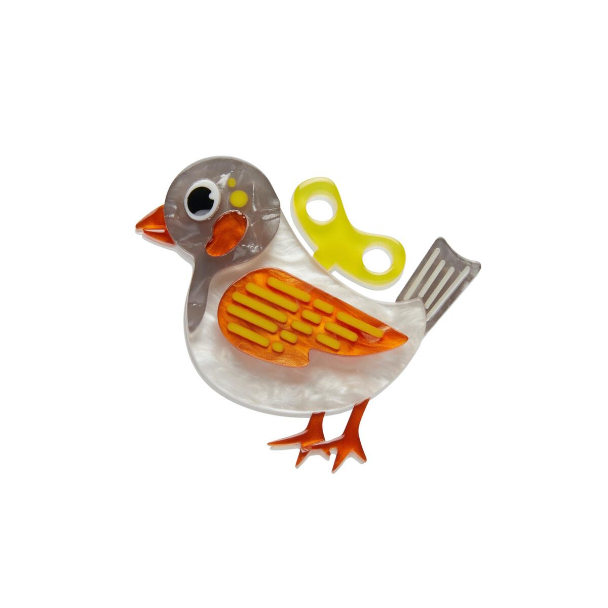 white, grey, orange, and yellow layered resin 2" key-operated toy bird brooch