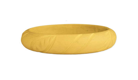 5/8" wide carved leaf pattern resin bangle in pale yellow