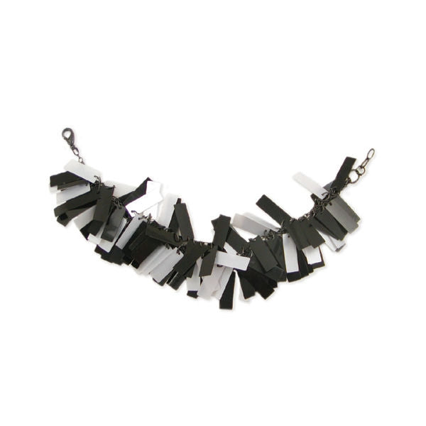 8" bracelet of many layers of 3/4" black and white bar sequins on black metal chain