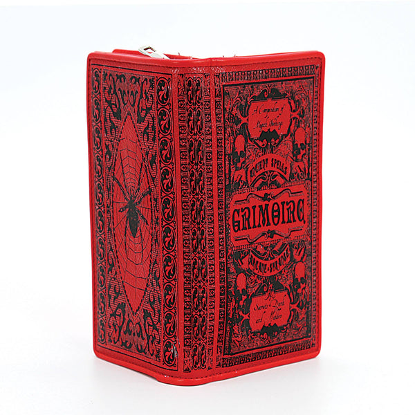 textured red faux leather with black print book-shaped "Grimoire: A Compendium of Magick Workings" wallet