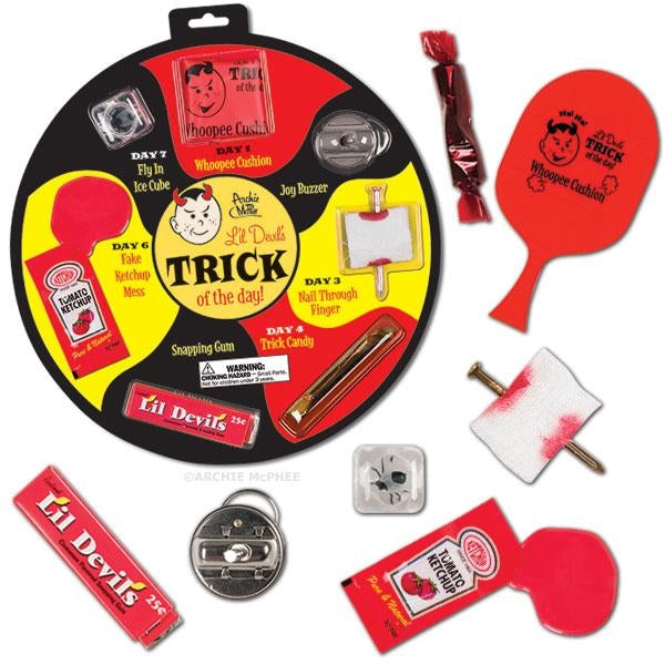 "trick of the day" 7 classic gags blister card packaged together: whoopee cushion, joy buzzer, nail thru finger, trick candy, snapping gum, fake ketchup, and fly in ice cube