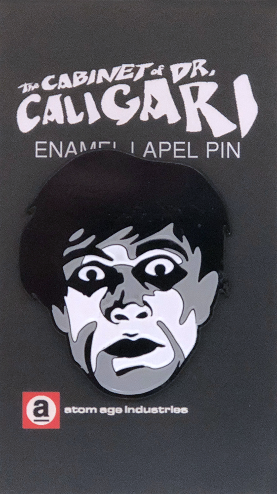 Face of somnambulist "Cesare" from the 1920 German Expressionist silent horror film, The Cabinet of Dr. Caligari on a black, grey and white enameled lapel pin