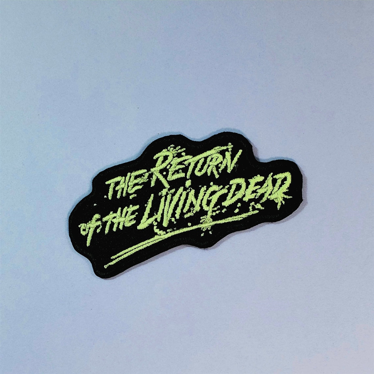 The Return of the Living Dead script logo glow-in-the-dark stitching on black background embroidered patch