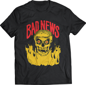 Bad News band logo flaming yellow skull image on a black 100% cotton men's sizing t-shirt printed with Plastisol Ink, shown flatlay