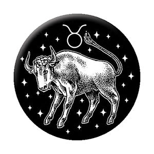 black and white illustrated Taurus zodiac sign imagery on 1.25" round metal pinback button