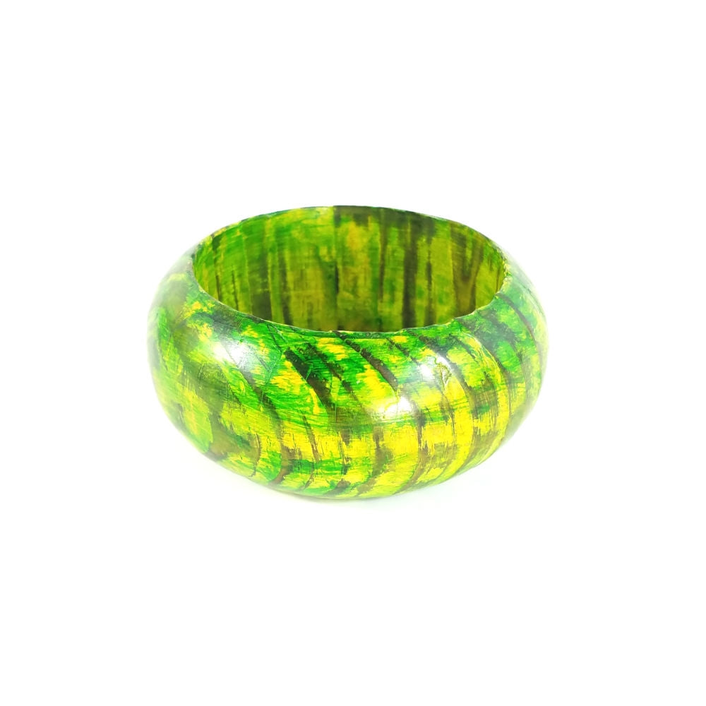 1 1/2" wide lightweight natural wood bangle with vibrant yellow and green paint, partially rubbed off to show off the grain