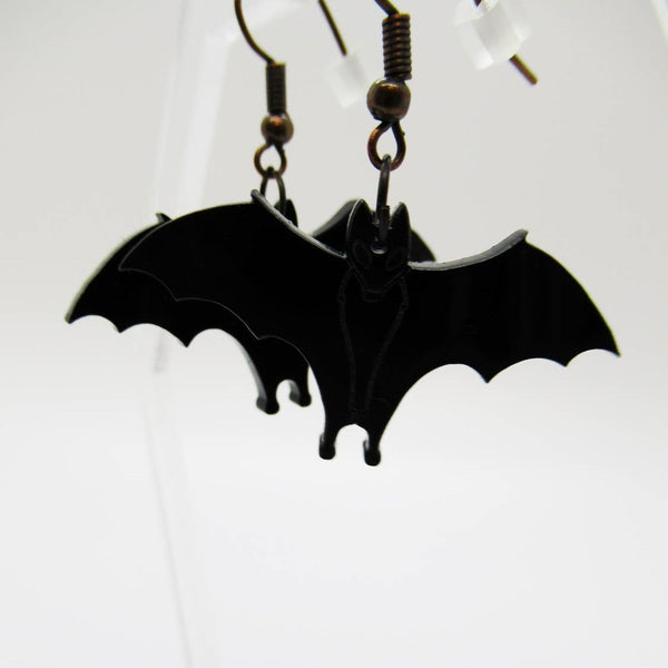 pair 1 1/2" laser-cut opaque black acrylic hanging bat dangle earrings with antiqued copper hooks