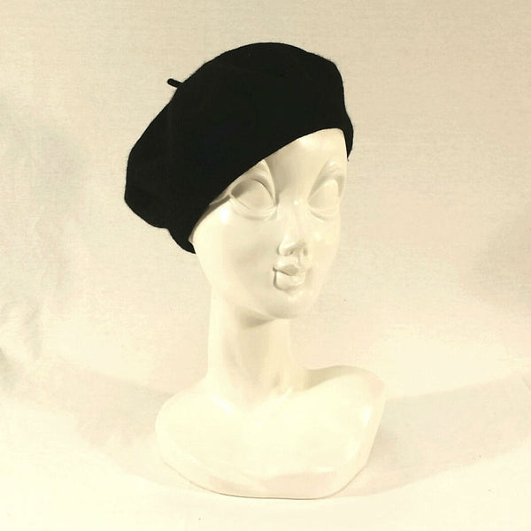 11" diameter "French" style wool blend knit beret in solid black, shown on mannequin head