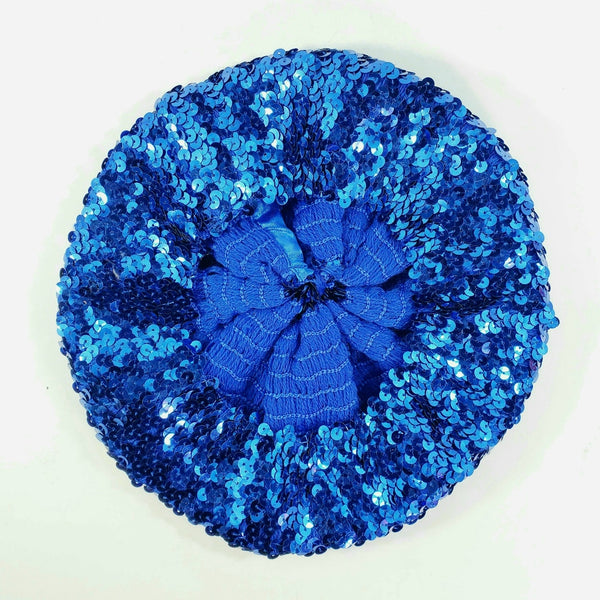 Sparkly shiny "French" beret in stretchy knit metallic royal blue sequin material, showing interior