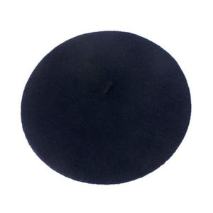 classic French style wool beret in dark navy blue, shown flatlay