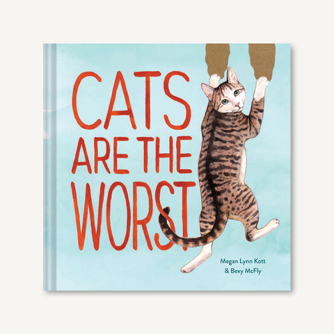 Cats Are the Worst by Megan Lyn Knott & Bexy McFly blue hardback book with red lettering and brown tabby cat illustration