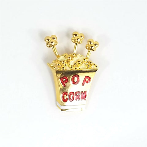 shiny gold metal "POP CORN" container brooch with red enameled lettering