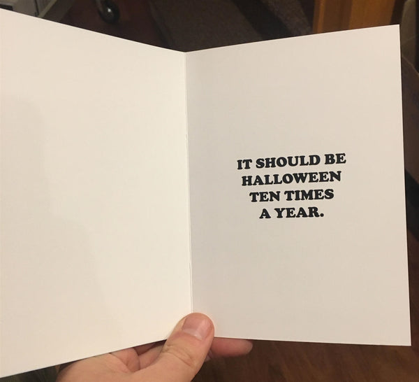 "IT SHOULD BE HALLOWEEN TEN TIMES A YEAR" interior card greeting in black text