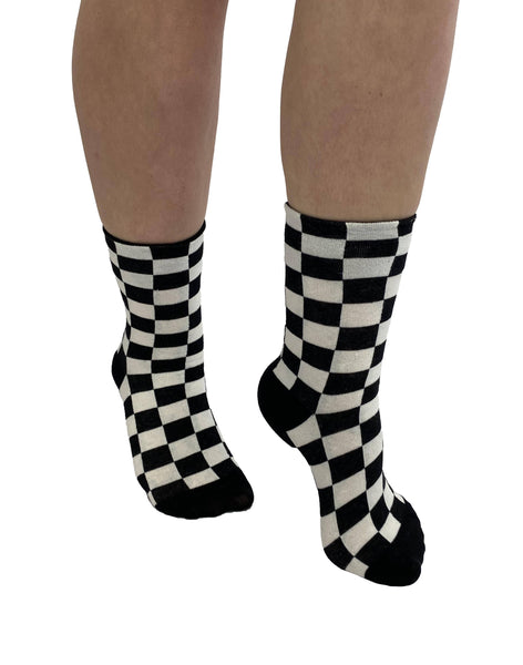 cotton blend knit socks in a classic black & white checker pattern, shown on model