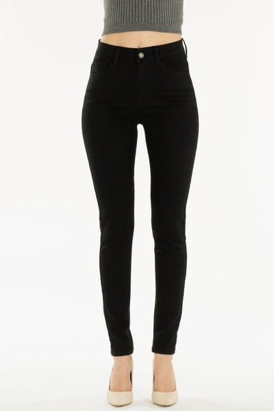 high waist black stretch denim 5 pocket skinny leg jeans, shown waist down on model