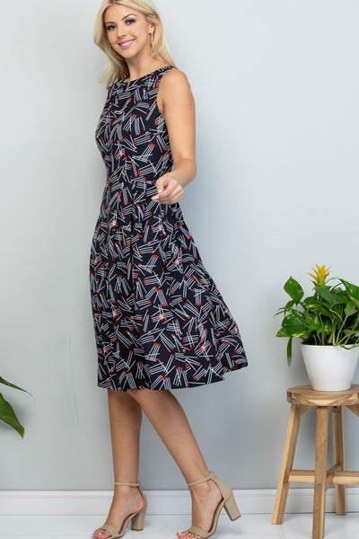 black with allover white & red stick matches print knee length sleeveless fit & flare dress, shown on model