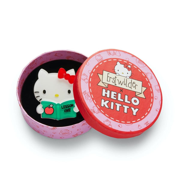 Hello Kitty Collection Lesson One white body red bow reading green book layered resin brooch