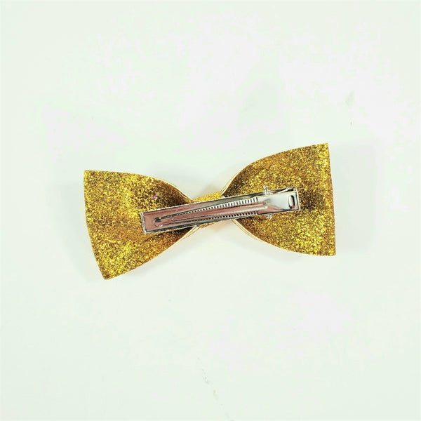 3 5/8" x 1 5/8"  bow hair clip in shimmery gold glitter encrusted stiff fabric on 2 1/8" gator clip fastener