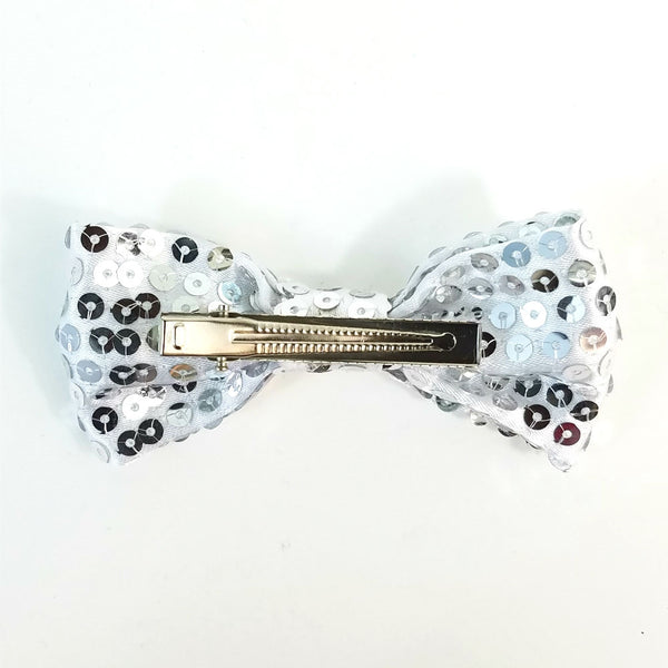4" x 2" bow hair clip of in silver satin with shiny matching color sewn-on sequins and 2 1/8" gator clip fastener, back view