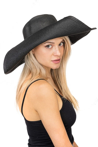 5.5" wide broad wired brim woven Toyo straw floppy black sun hat, shown with rolled brim on model 
