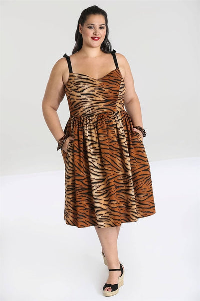Tora Tiger Print 50s Dress features a sweetheart neckline, fitted princess seamed bodice with adjustable bow-decorated black cotton spaghetti straps, full swingy just-below-the-knee length skirt, shown on model