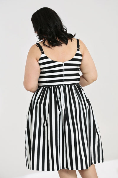 Juno 50s Dress black & white stripe print sweetheart neckline, fitted princess seamed bodice with adjustable black spaghetti straps and gathered just-below-the-knee length skirt, shown back view on model