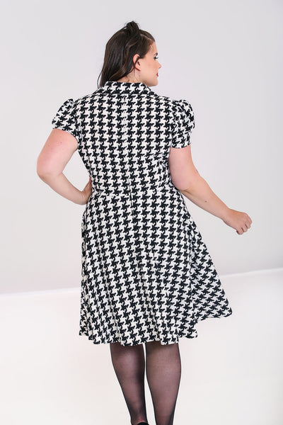 black and ivory houndstooth puffed shpulder short sleeve knee length flared skirt shirtwaist dress, shown back view on model