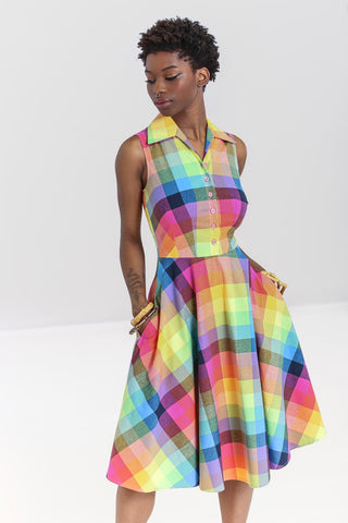rainbow check plaid dress features a fitted sleeveless bodice with pink button closure and wide pointed collar, and full just-below-the-knee length skirt, shown on model
