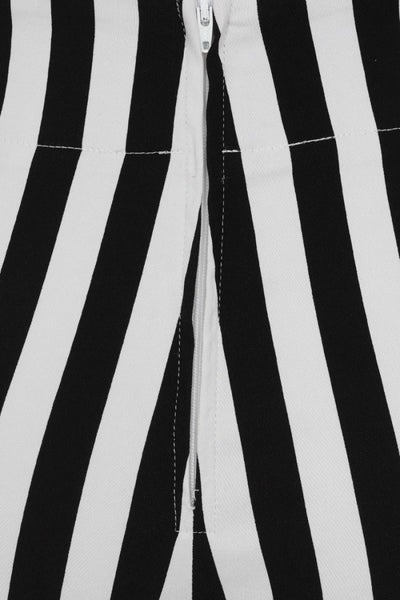 retro high waist fitted stretch capri length pants in vertical black & white stripe print, cropped close-up showing back zipper
