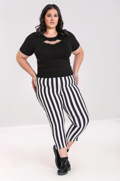 retro high waist fitted stretch capri length pants in vertical black & white stripe print, shown on model
