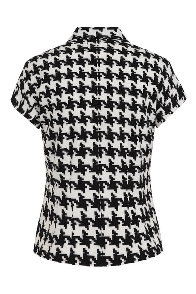 black and ivory houndstooth print short sleeve blose with black fabric tie at collar, shown back view