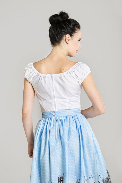 retro style white stretch cotton peasant top featuring princess seamed bodice, cap sleeves, and peek-a-boo keyhole opening with button detail at the bust, shown back view on model