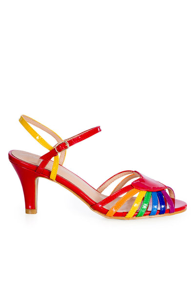 side view of patent rainbow design strappy 2 1/2" heel sandals with red heart detail