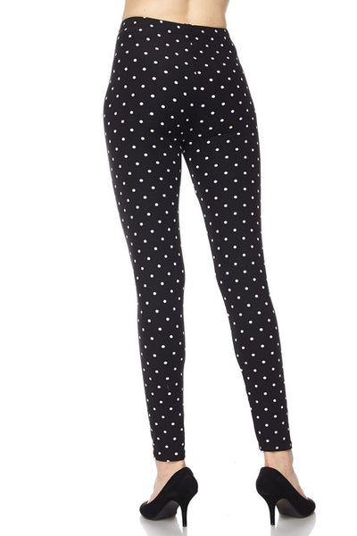 stretch knit high-waist leggings in back with white polka dot print, shown on model