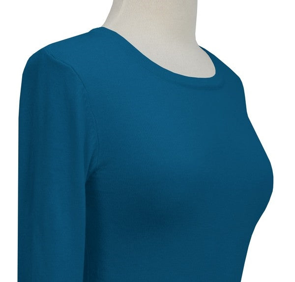 fitted pullover sweater in a slightly cropped length with crew neck and 3/4 sleeves in rich teal blue, shown close-up on dress form