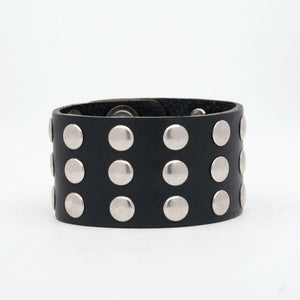 thick black leather 1 5/8" wide cuff with 3 rows of 3/8" round silver metal rivets and heavy duty snap closure