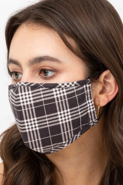 black & creamy white plaid print cotton shaped double layer face mask with adjustable black ear loops, shown on model