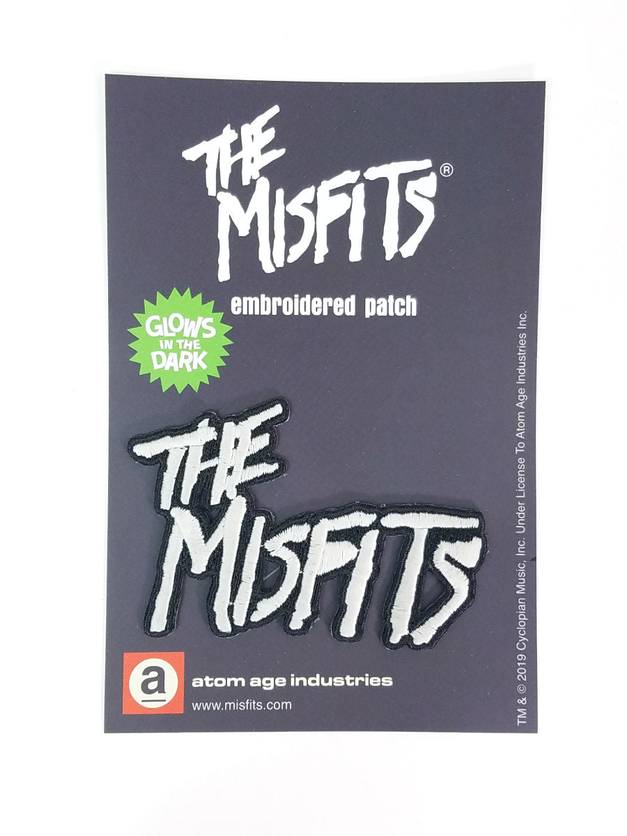 Misfits 1977 logo glow-in-the-dark embroidered patch, shown on black backer card packaging