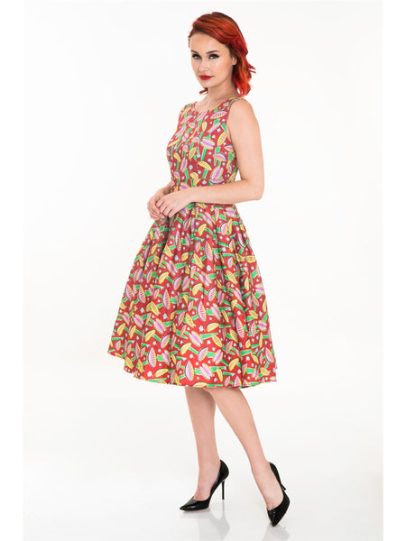red background Venus Fly Trap print dress sleeveless fitted high neckline princess seamed bodice, wide banded waist, full gathered just below the knee length skirt, shown on model side view