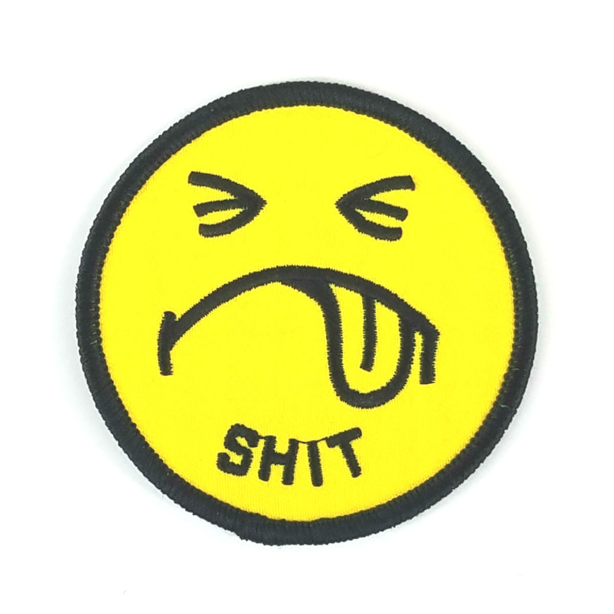 3" round yellow and black embroidered patch of 70s style frowny face with tongue out and "SHIT" exclamation text